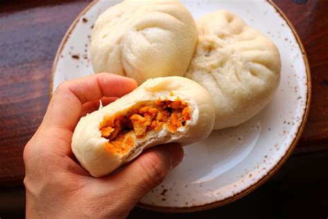   Steamed Stuffed Buns (Baozi) Filled with Juicy Pork and Sweet Fragrant Cabbage: Can These Pillowy Pockets of Flavor Conquer Your Taste Buds?